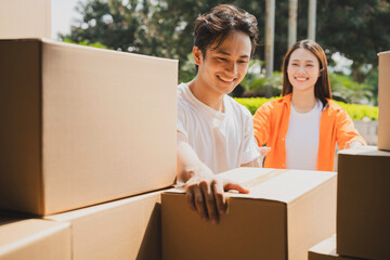 Photo of young Asian couple working together