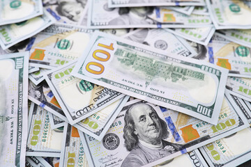 Group of money stack of 100 US dollars banknotes a lot of the background texture. Cash money in a large pile as a finance background.