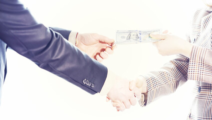 Woman Hand taking cash paper money from man hand.Banknote exchange.Paying woman for service or...