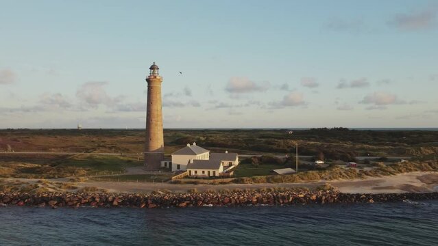 Active Gray Lighthouse Of Skagen In The Far North Of Jutland, Denmark. Aerial Sideways Shot