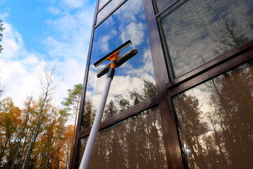 Washing windows with a window brush. Window cleaning brush for windows.