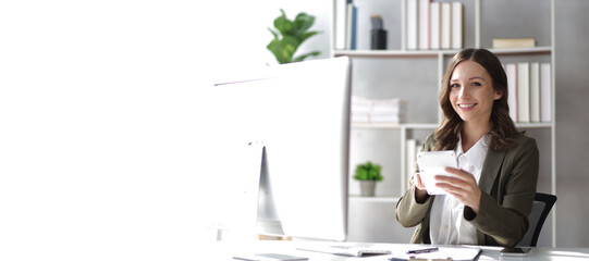 Attractive businesswoman working in the office.