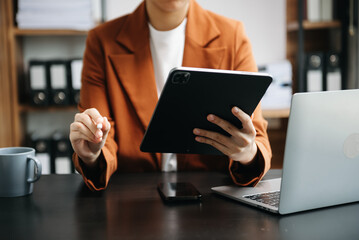 businesswoman hand working with new modern computer using on smartphone and tablet as concept.