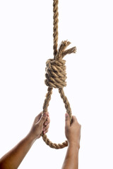 Man hand holding rope with a hangman noose knot