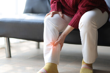 Senior woman with osteoarthritis has leg pain. - obrazy, fototapety, plakaty