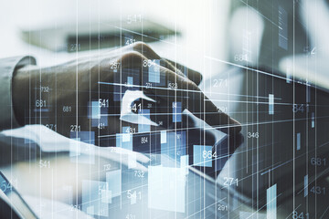 Double exposure of abstract creative statistics data hologram with finger clicks on a digital tablet on background, statistics and analytics concept