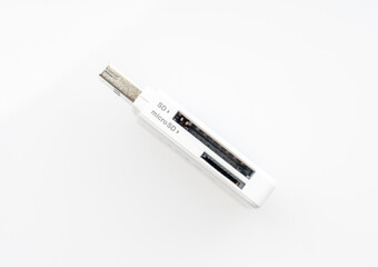 Obraz premium Flashcard card reader on white background close-up with reflection