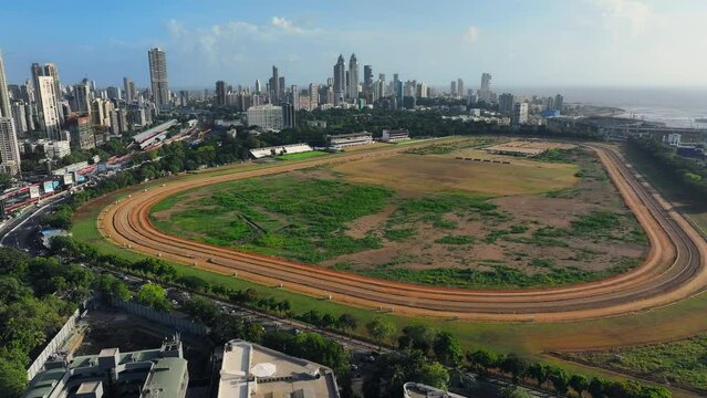 Mumbai cityscape with Mahalaxmi Racecourse in the center, Mahalakshmi Railway station and racecourse showing the Arabian Sea Mumbai Maharashtra, India, Asia.