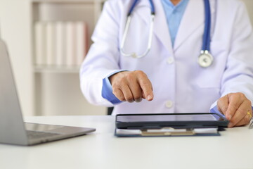 Doctor working in the medical office at the hospital.