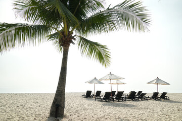 Relaxing chairs beside beach views.