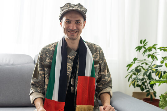 Soldier holding national flag - United Arab Emirates