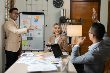 Asian businessmen, women and men Talk about new projects, presents at home office.