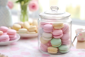 Fototapeta na wymiar a table with pastel-colored macarons in a glass jar