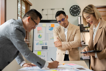 Asian businessmen talk about new projects have fun.