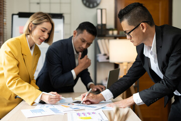 Asian businessmen, women and men Talk about new projects, presents at home office.