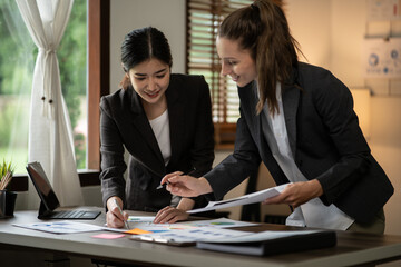 Partner lawyers or attorneys discussing a contract agreement. Successful businesswomen have a contract in place to protect it,signing of modest agreements form in office...