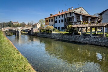 Fototapeta premium Breathtaking view of the Naviglio Grande canal in the Lombardy region of Italy