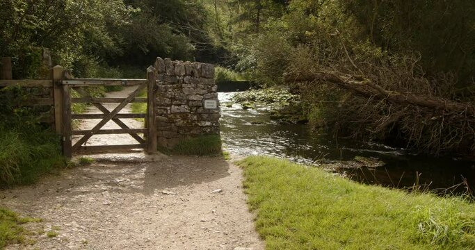 Shot of a gate midway through the dovedale walk with the river dove on the right hand side
