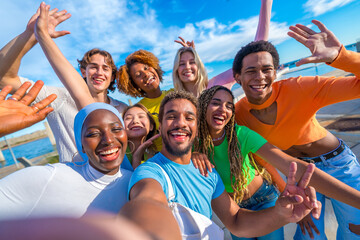 Happy young people taking a selfie in the city