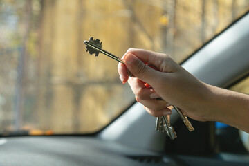 Caucasian female hand showing house keys.