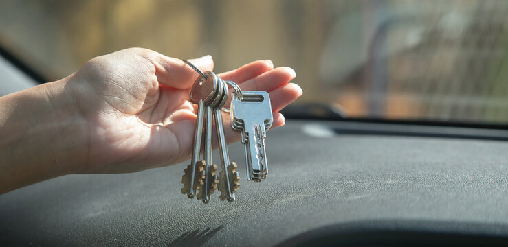 Caucasian Female Hand Showing House Keys.