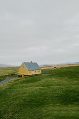 Fototapeta na wymiar Yellow House in the countryside landscape in Iceland