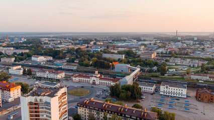 Fototapeta na wymiar Yoshkar-Ola, Russia - September 24, 2022: Train Station. Panorama of the central part of the city from the air during sunset, Aerial View