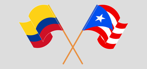 Crossed and waving flags of Colombia and Puerto Rico