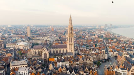 Fotobehang Antwerpen Antwerp, Belgium. Spire with the clock of the Cathedral of Our Lady (Antwerp). Historical center of Antwerp. City is located on river Scheldt (Escaut). Summer morning, Aerial View