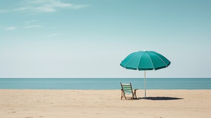 A minimalist scene featuring a singular chair and umbrella, symbolizing solitude amidst the expansive beach landscape. - obrazy, fototapety, plakaty