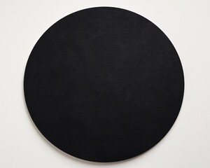 an image of a black circle on top of a white sheet of earthcore chalk with high angles