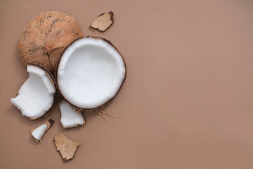 Fresh coconuts are displayed on the left half of the frame, with space on the right for image and text design to advertise products with a vegan cosmetics theme.