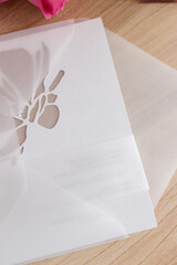 Wedding invitation cards. Snow-white wedding card made of corrugated expensive paper in envelope.