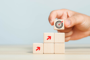 Wooden blocks showing planning goals, business investment concept, strategy, business, vision, precision, digital, objectives, customers, objectives, value, goals, investment growth, and development.