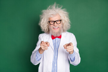 Photo of happy cheerful good mood funky mad scientist with messy hair point finger you isolated on...