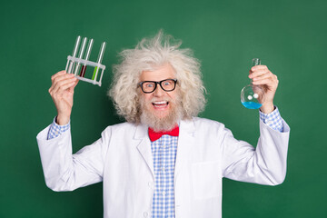 Photo of busy crazy mature inventor dressed white uniform bow tie glasses rising test tubes...
