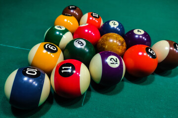 Pool cues close-up on a green table for playing