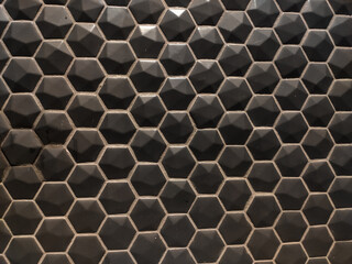 Texture of glossy black mosaic tiles hexagon