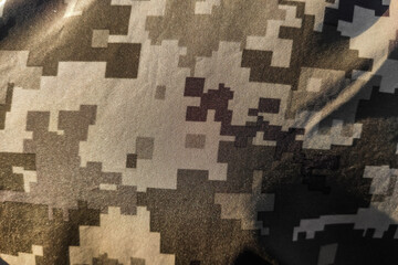 Texture close-up pixel camouflage military uniform of the Armed Forces