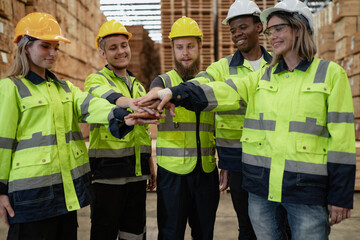 Group of teamwork person standing in warehouse holding hands strength collaboration. Business partnership success together team. Diversity people in safety uniform unity friendship, circle connection.