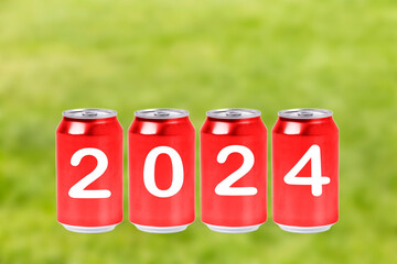 2024, Red soda cans with the number 2024 on green background. Happy New Year