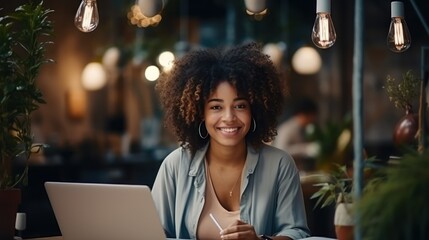 Portrait of smiling african american businesswoman working with laptop in cafe Generative AI - obrazy, fototapety, plakaty