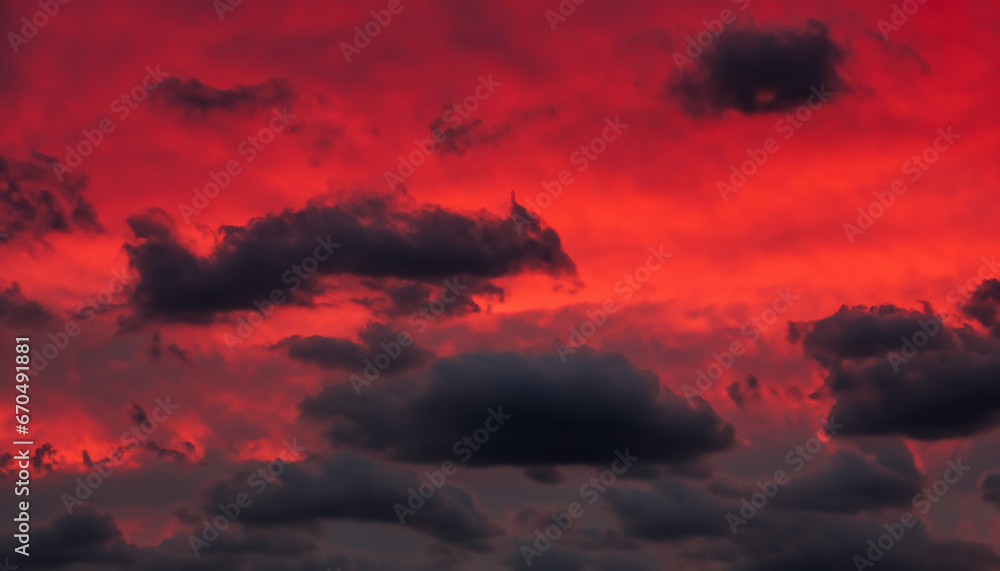 Poster abstraction of red sky with dark clouds.