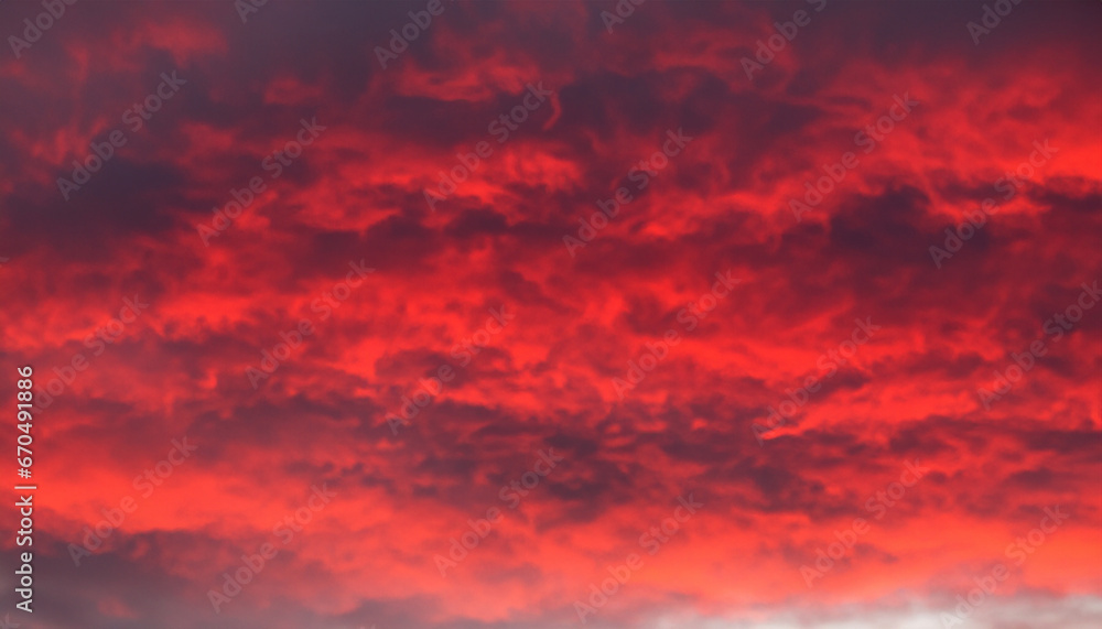 Poster flaming red sky with abstract clouds.
