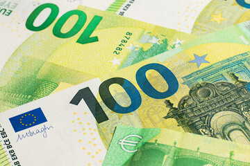 many banknotes of 100 Euro, the European currency, the concept of income and inflation - obrazy, fototapety, plakaty