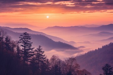 Foggy mountains in autumn during sunset. Purple mountain tops with fog.