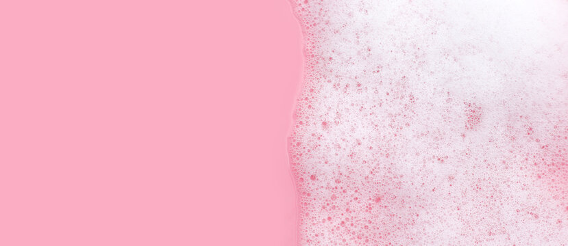 White soap suds foam bubble on blue background.