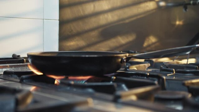 Flame heats a hot pan in the kitchen of an Italian cruise ship