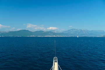 sea cruise with a view of the Bay of Kotor in Montenegro, beautiful views of nature and mountains, occasional yachts, travel