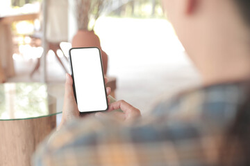 cell phone blank white screen mockup.hand holding texting using mobile on desk at office.background empty space for advertise.work people contact marketing business,technology